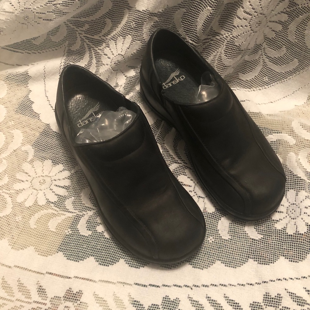 Dansko leather slip on black clogs 49360202